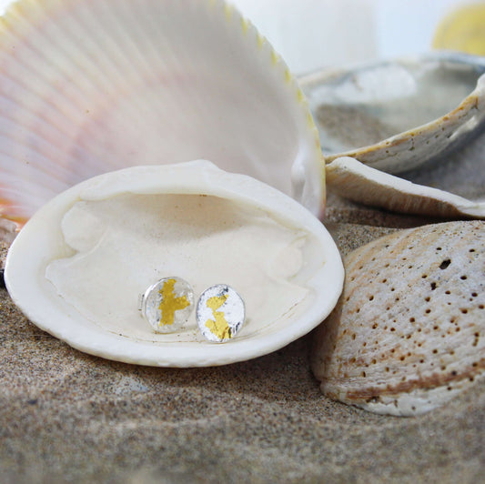 Oval An Ghrian Stud Earrings in Reticulated Silver and Keum Boo 24k gold displayed in a shell by Atlantic Rose